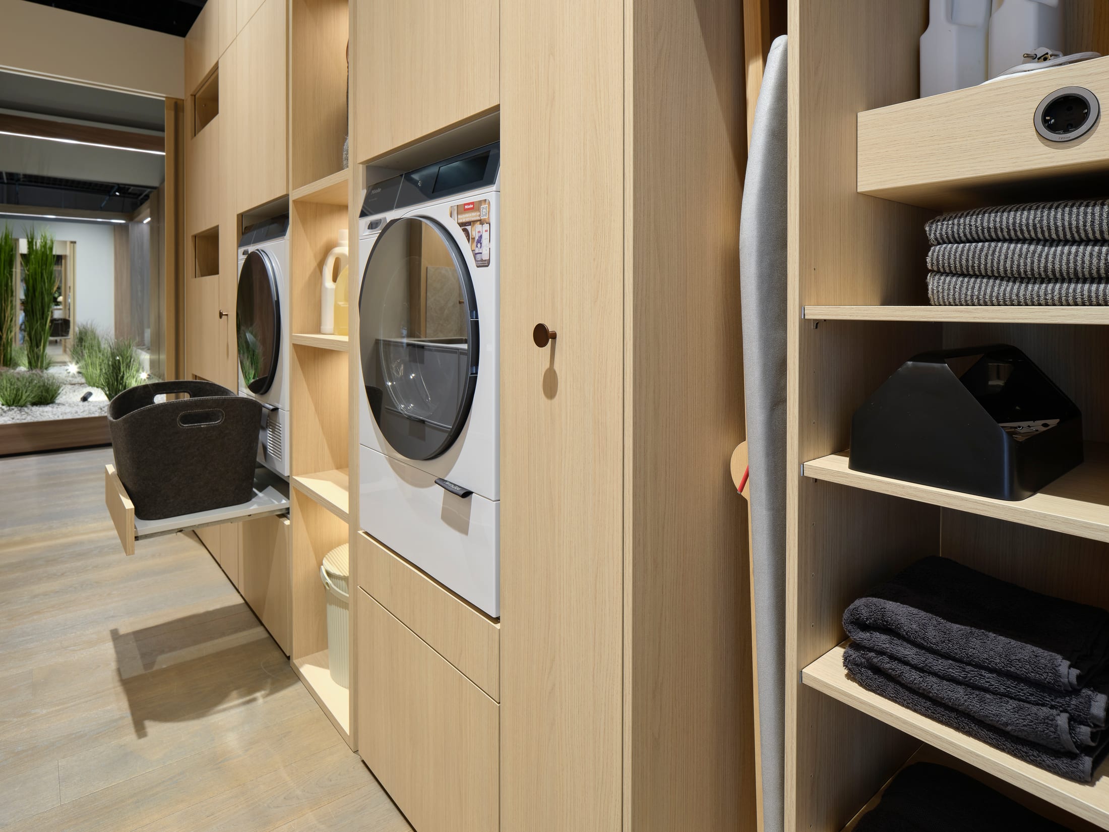 Laundry wall in light oak with raised washer and dryer