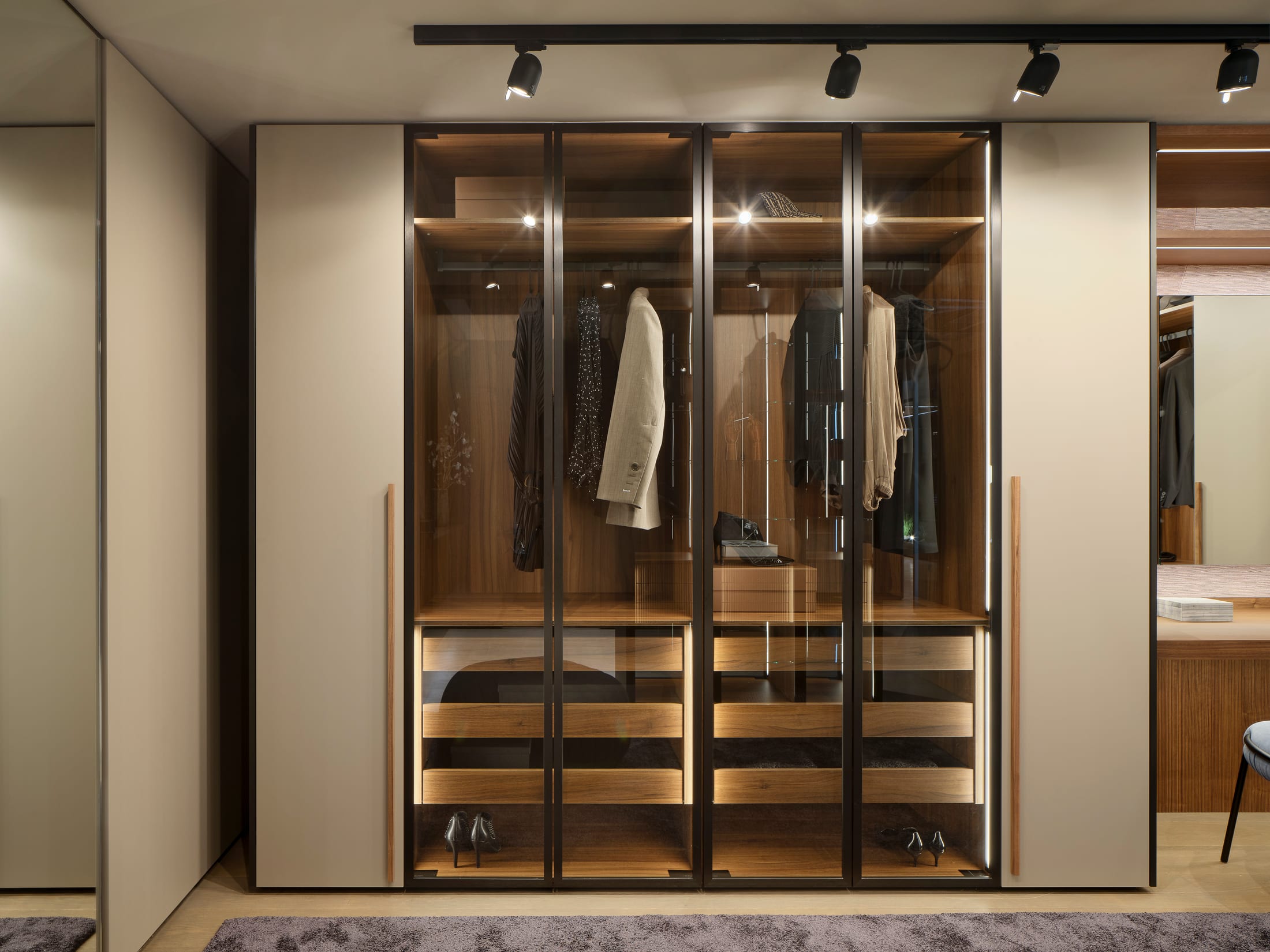 Lit glass wardrobe with walnut drawers