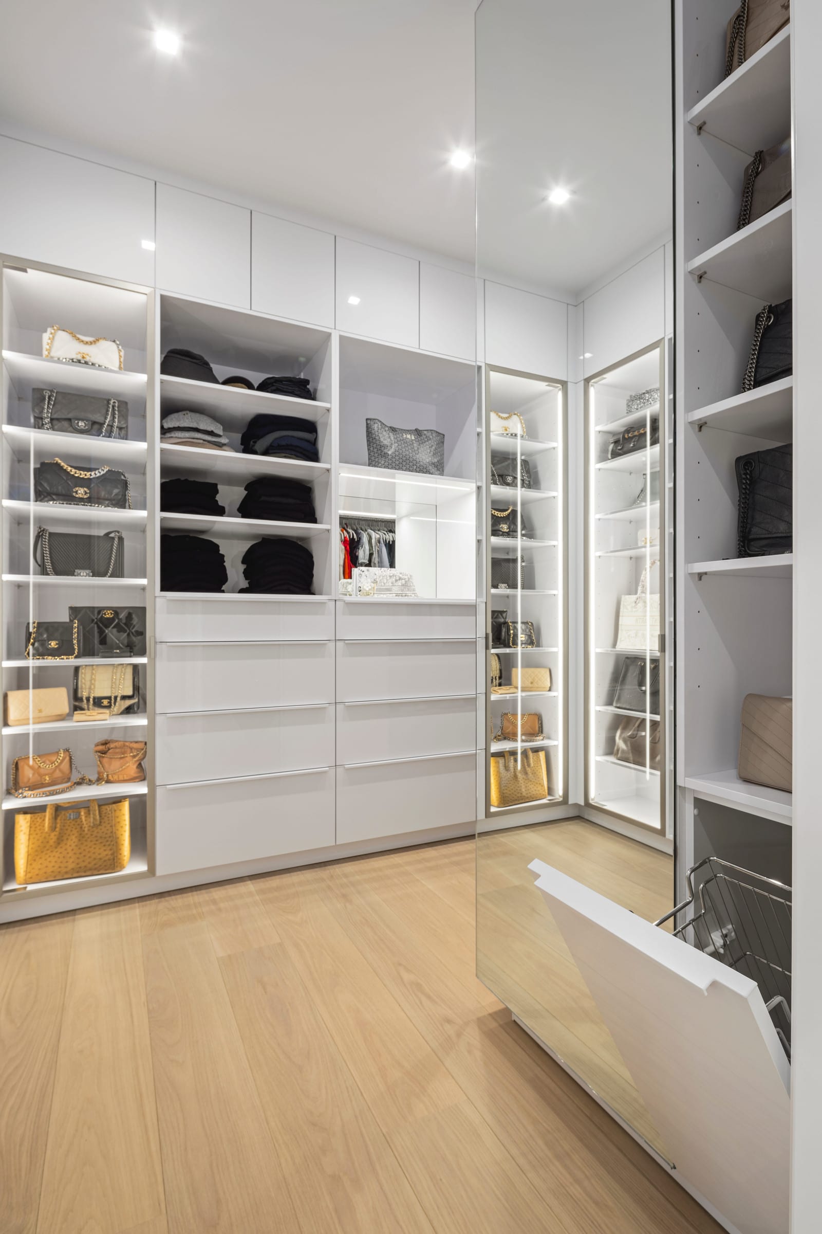 White laundry room with stacked washer and dryer, Purchase NY