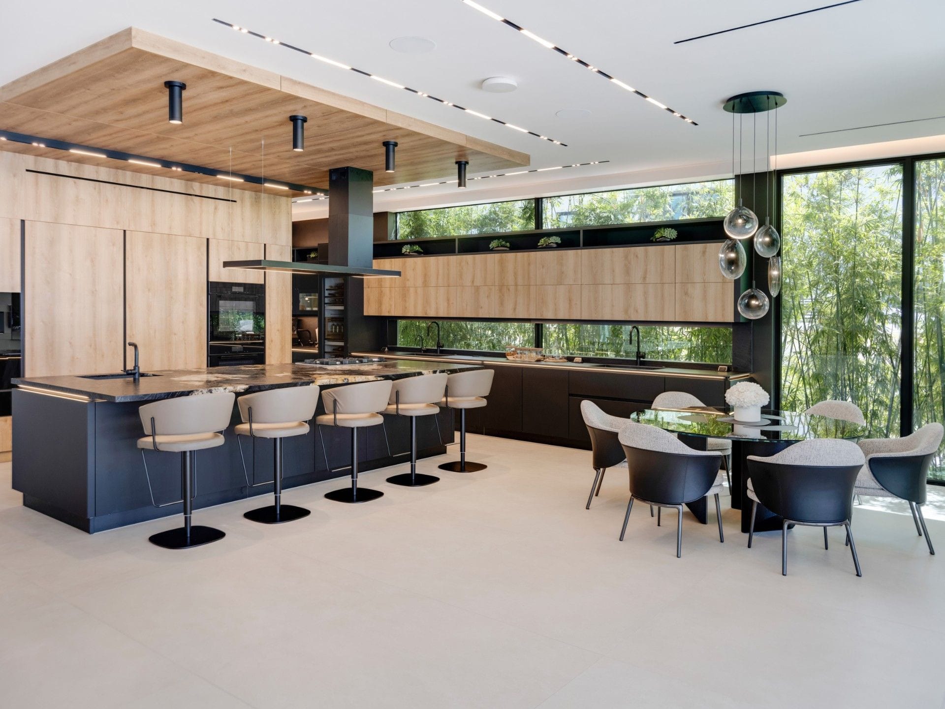 Island and tall oak wall with integrated ovens