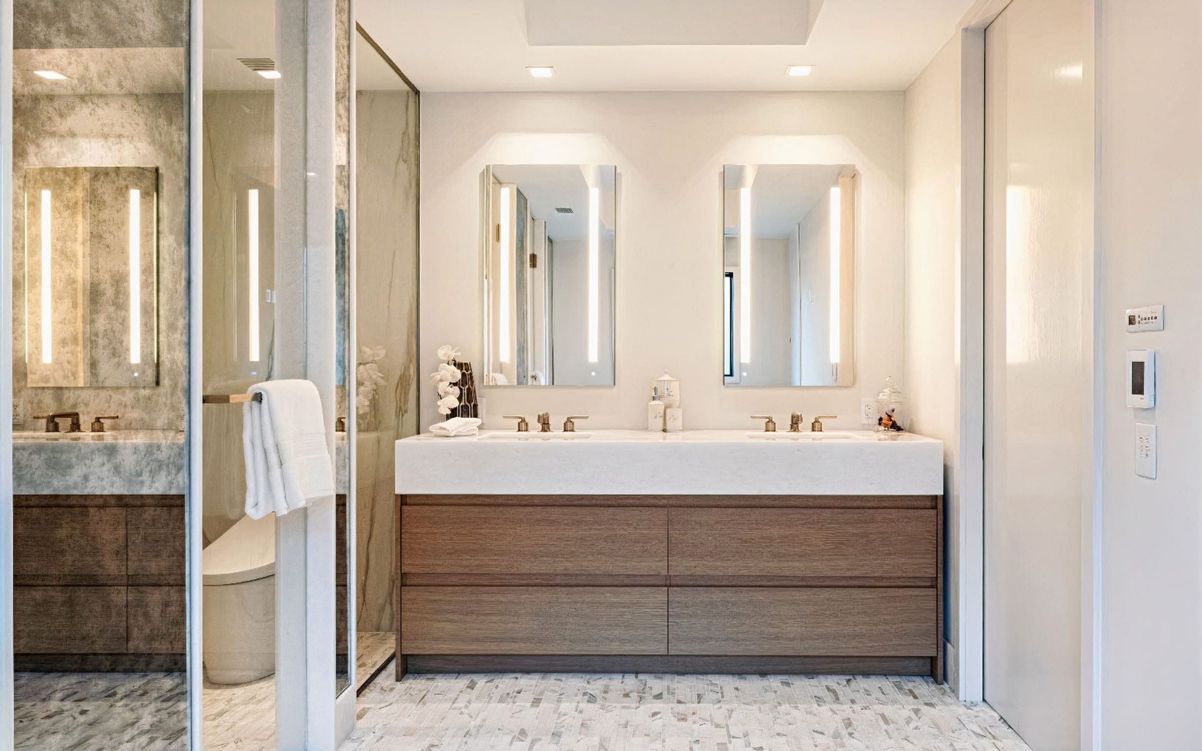 Floating walnut double vanity with lit mirrors, Greenwich CT