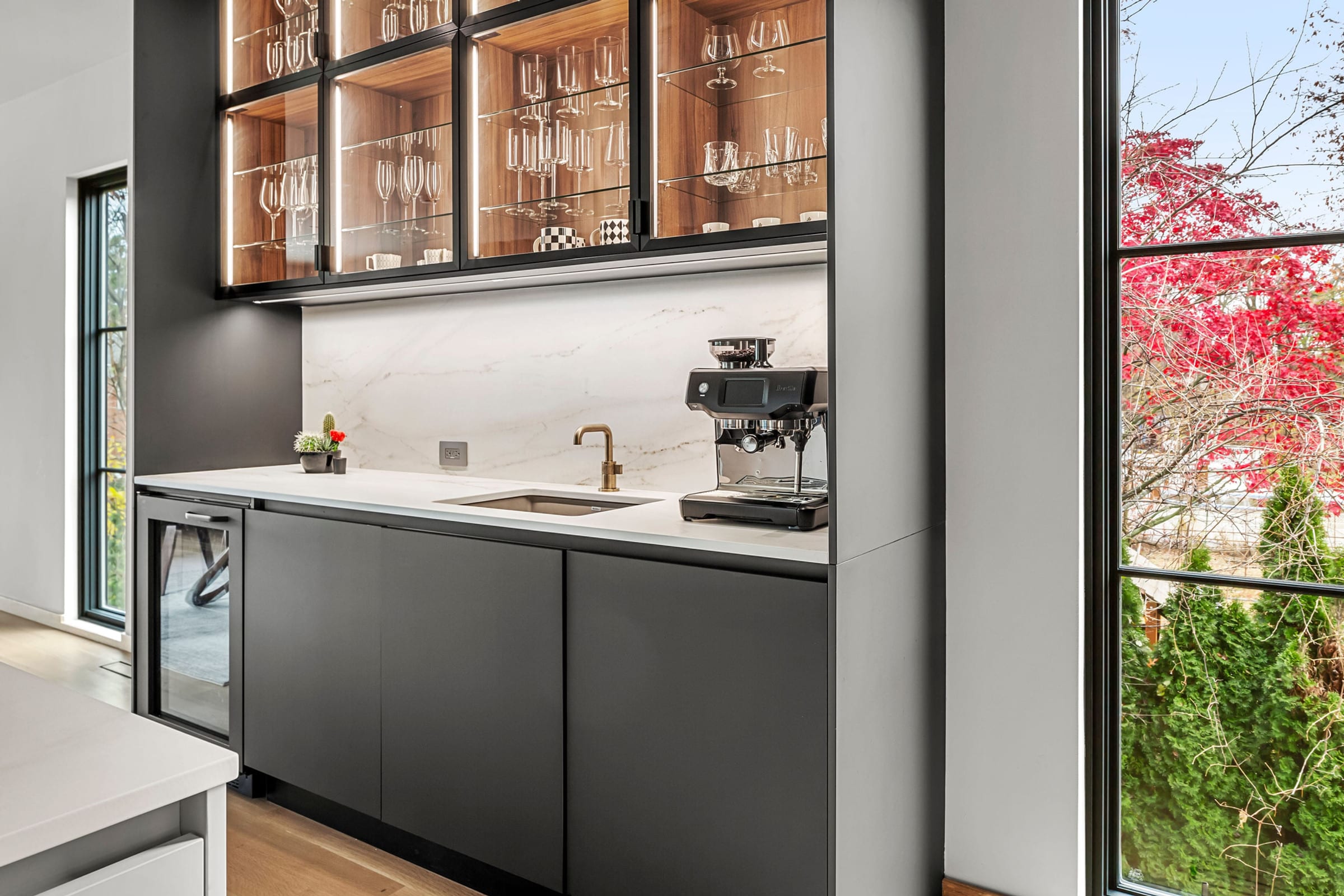 Black glass bar cabinet with coffee station